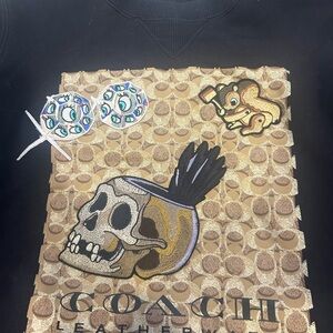 Disney Coach signature sweatshirt. Skull